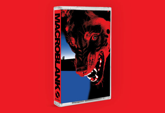 A cassette-style music album case standing upright on a solid red background. The cover art features a stylized red-and-black snarling dog face with a blue vertical band behind it.